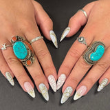 Handcrafted chunky Nepalese silver rings with turquoise stones, ethical artisan jewellery