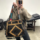 Boho festival travel bag with colourful embroidered design