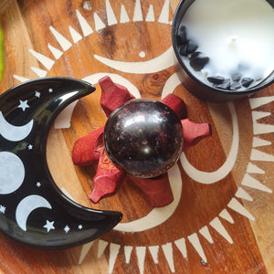 garnet sphere on wooden board